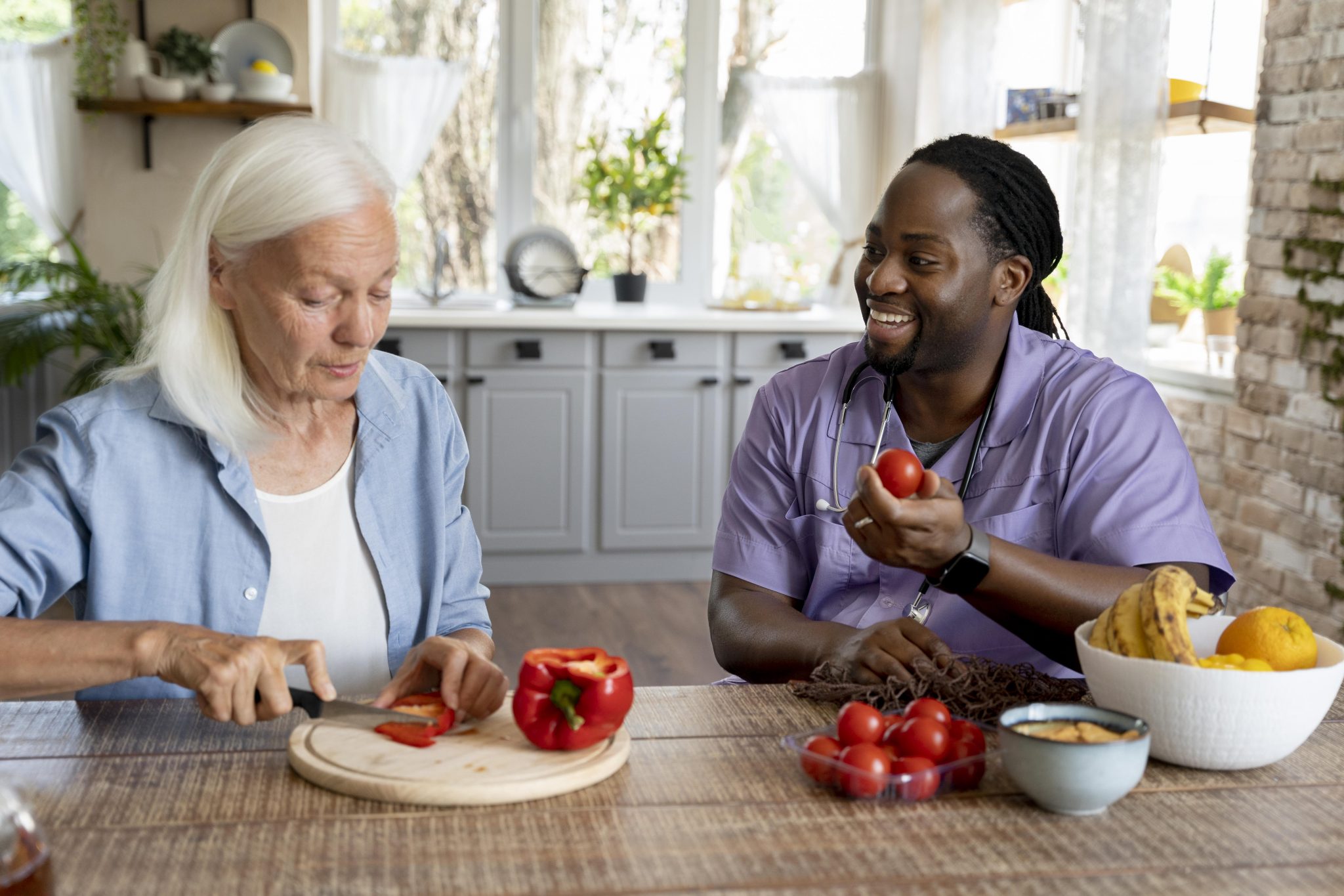 Carer helping a client prepare a meal at home